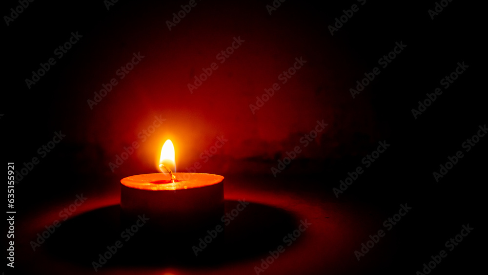 small round scented candle with a glass of vodka small round scented candle with a glass of vodka