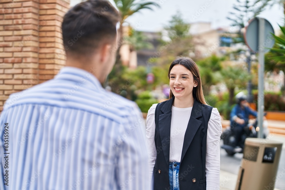 Man and woman couple smiling confident standing together at street Man and woman couple smiling confident standing together at street