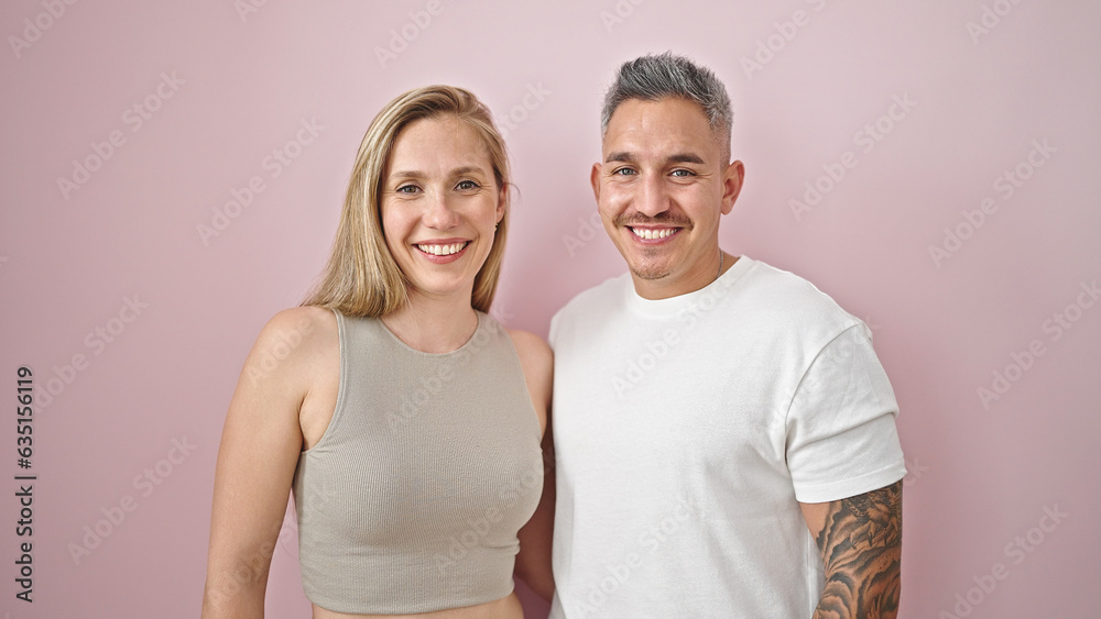Man and woman couple standing together smiling over isolated pink background Man and woman couple standing together smiling over isolated pink background