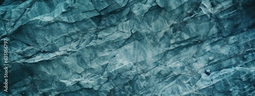 Blue green gray teal aqua turquoise rough mountain surface. Close-up. Toned stone rock mineral granite texture background. Cracked, crumbled. Underwater, water or ice, frost effect.Color gradient.Dark