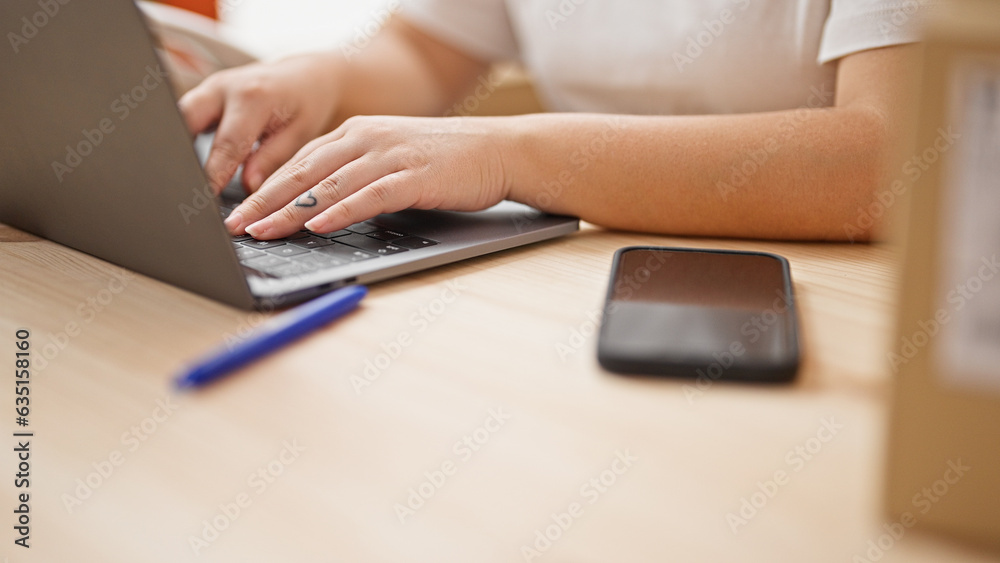 Young beautiful hispanic woman ecommerce business worker typing on computer at the office Young beautiful hispanic woman ecommerce business worker typing on computer at the office