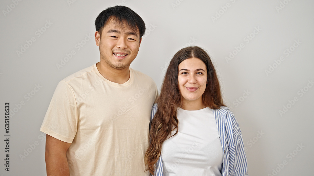 Man and woman couple smiling confident hugging each other over isolated white background Man and woman couple smiling confident hugging each other over isolated white background