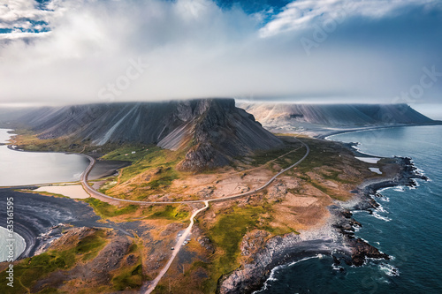 Eystrahorn headland or Krossasnesfjall mountain range with foggy covered among peninsula in summer at Iceland
