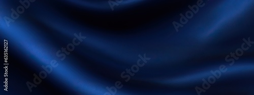 Navy blue silk satin. Dark elegant luxury abstract background with space for design. Shiny smooth fabric. Soft folds. Drapery. Color gradient. Lines. Wavy pattern. Christmas, birthday, romance.