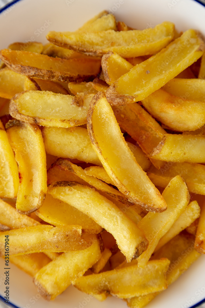 Homemade French Fries on a Plate, top view. Flat lay, overhead, from above. Close-up. Homemade French Fries on a Plate, top view. Flat lay, overhead, from above. Close-up.