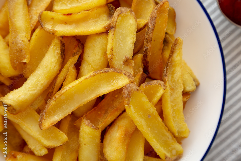Homemade French Fries on a Plate, top view. Flat lay, overhead, from above. Close-up. Homemade French Fries on a Plate, top view. Flat lay, overhead, from above. Close-up.