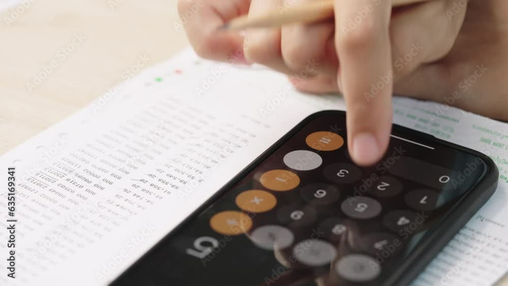Hand Woman Using Calculator form Smart phone for Accounting and Financial analysts see data Report on Document paper Hand Woman Using Calculator form Smart phone for Accounting and Financial analysts see data Report on Document paper