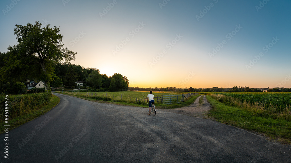 Cyclist Stops at a Crossroads Cyclist Stops at a Crossroads
