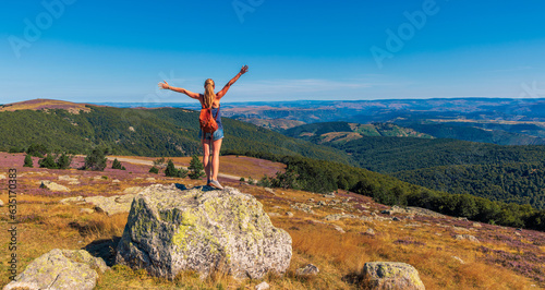 traveler woman standing and enjoying panoramic landscape view- travel, tourism,vacation,freedom concept
