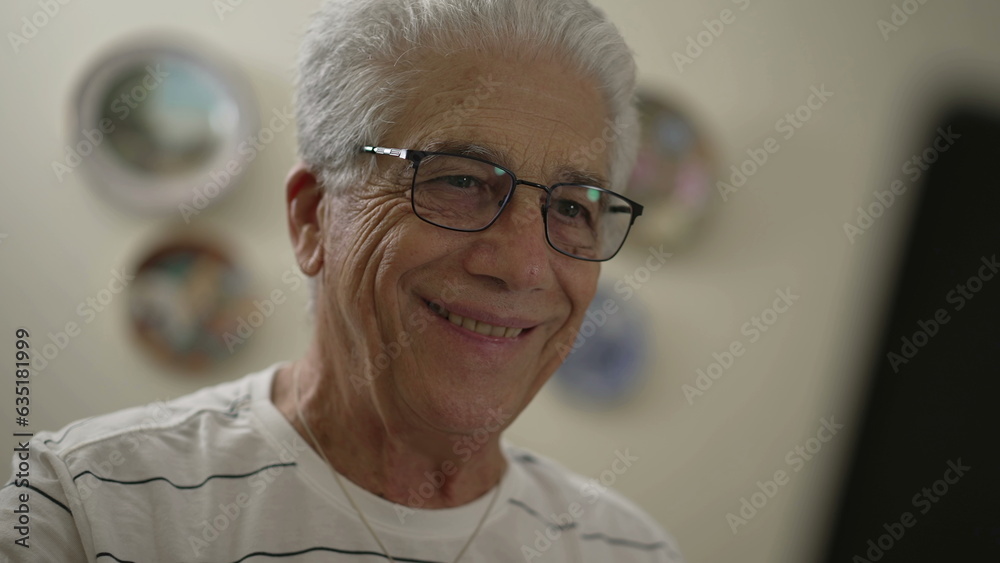 Elderly man becoming happy in front of computer screen, close-up face of an older person using technology smiling and liking content online or message Elderly man becoming happy in front of computer screen, close-up face of an older person using technology smiling and liking content online or message