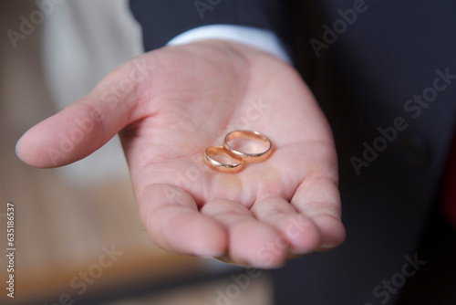 wedding rings on the groom's hand dissolve