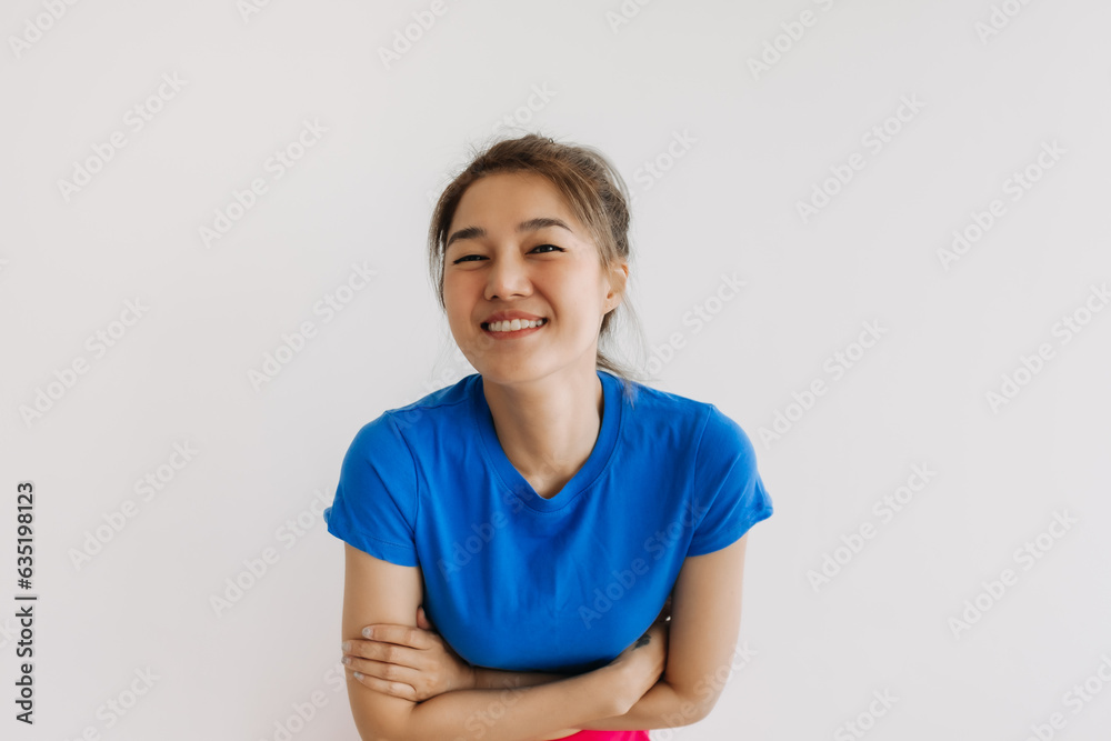 Close up of happy asian woman in blue t-shirt isolated on white. Close up of happy asian woman in blue t-shirt isolated on white.