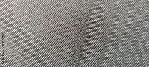 Close-up view of dark gray textile textured background. Abstract fabric material pattern. Copy space for your text or decoration.
