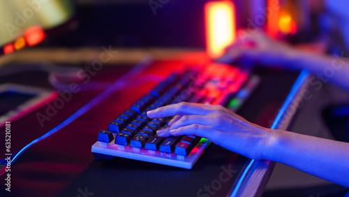 Close up of hands using keyboard for Online video game .
