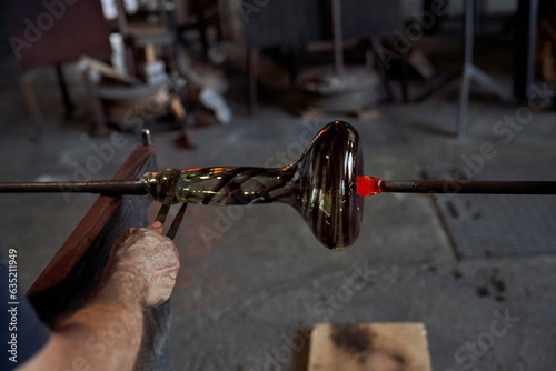 Crop craftsman making hookah base using jacks photo