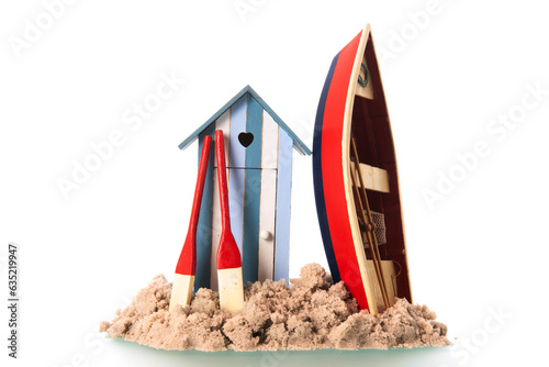 Beach hut an boat in sand