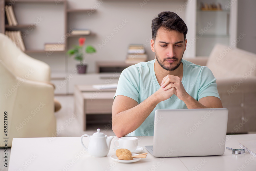 Young male freelancer working from home Young male freelancer working from home