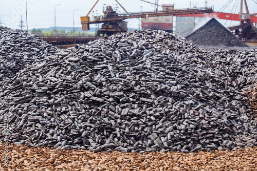 Large heap of briquetted iron photo