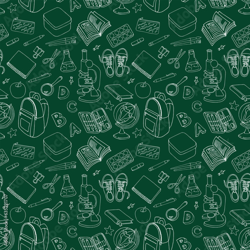 a seamles pattern of school subjects  on the background of the blackboard