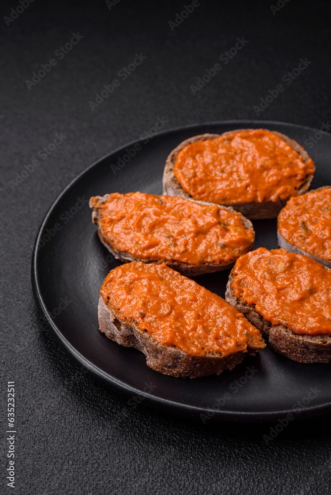 Delicious sandwich consisting of toast, red sauce with salt, spices and herbs Delicious sandwich consisting of toast, red sauce with salt, spices and herbs
