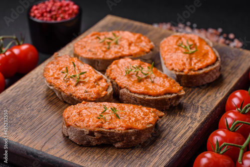 Delicious sandwich consisting of toast, red sauce with salt, spices and herbs