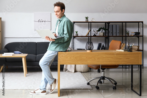 Male freelancer working wit...