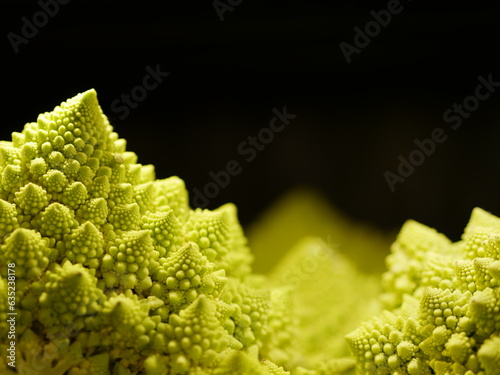 Romanesque cauliflower, artistic shot of vegetables, close up detail of texture of exotic fresh green cooking ingredient photo