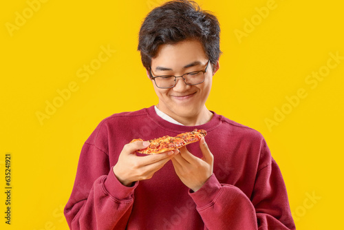 Young Asian man with tasty ...
