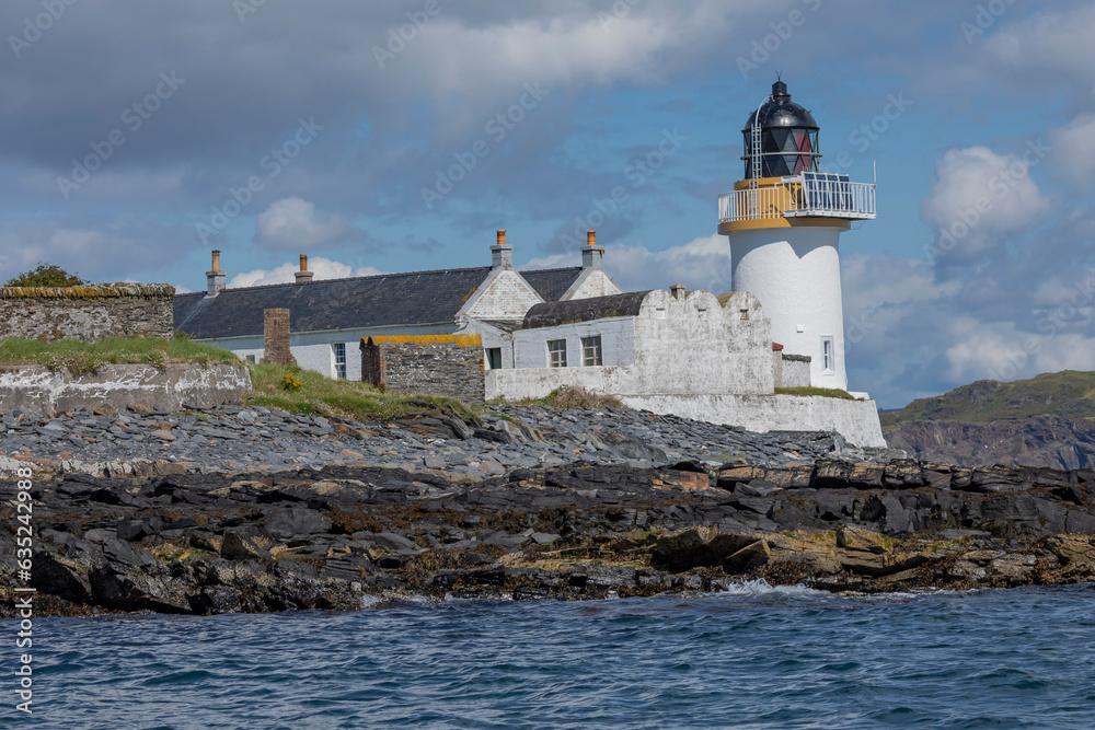 Lighthouse and its buildings on a scottish island