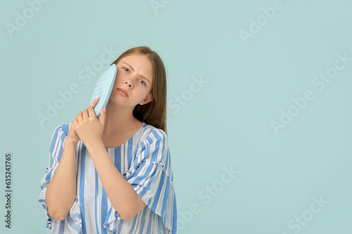 Young woman with tooth ache...