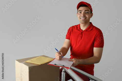 Male courier with clipboard...