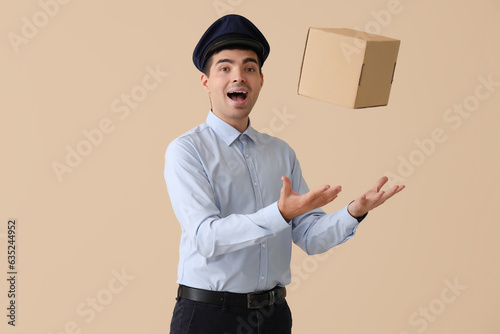 Young postman throwing parc...