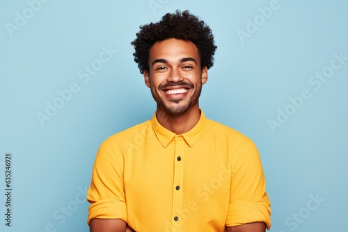 Portrait of a young fictional man smiling. Isolated on a plain colored background. Generative AI.