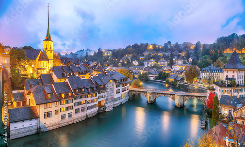 Incredible autumn view of Bern city at evening. Scene of Aare river with Nydeggkirche - Protestant church.