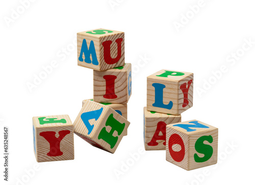 Children's wooden cubes with blue, red and green letters in the shape of a tower stand one on top of the other and lie side by side. No background. High quality photo.