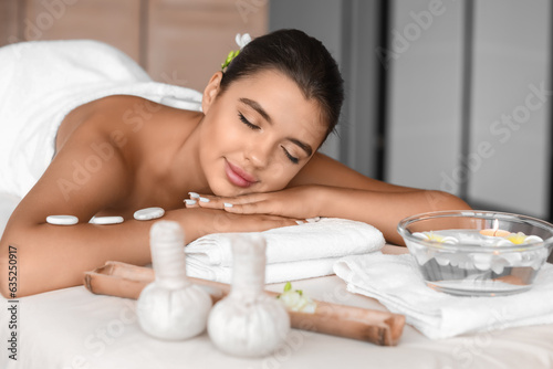 Beautiful Caucasian woman relaxing in spa salon