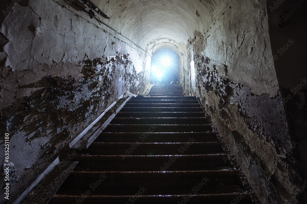 Obraz premium Old vaulted corridor of Soviet bunker, echo of Cold War