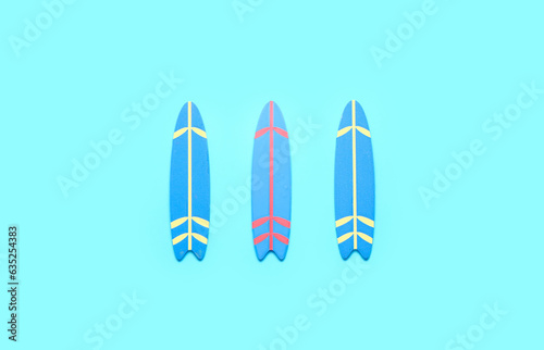 Mini surfboards on blue bac...