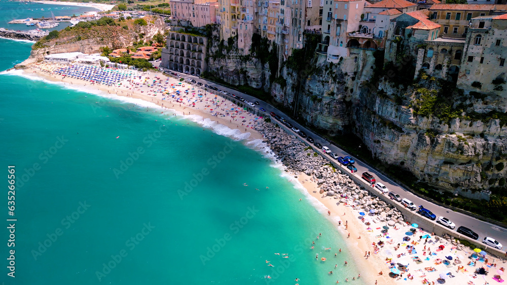 Aerial view of Famous Italian town Tropea: Colorful Houses and Turquoise Waters Along Italy's Picturesque Coast	