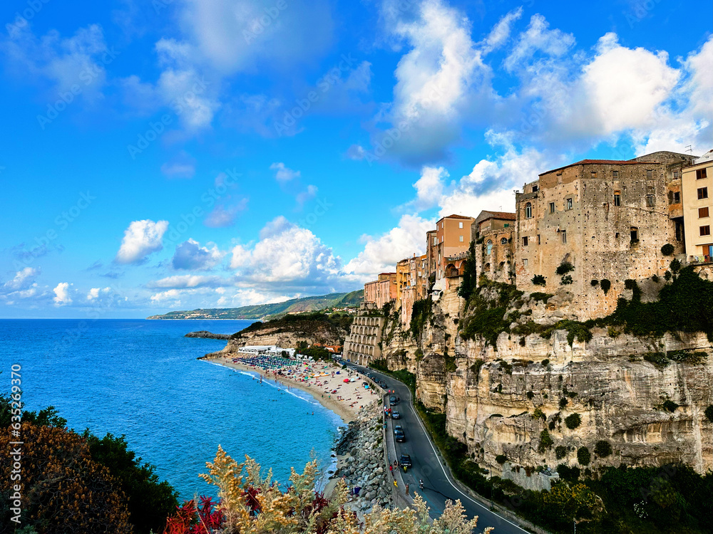 Tropea's Timeless Charm: Aerial View of Colorful Houses, turquoise waters, rugged cliffs, and charming town in Italy	