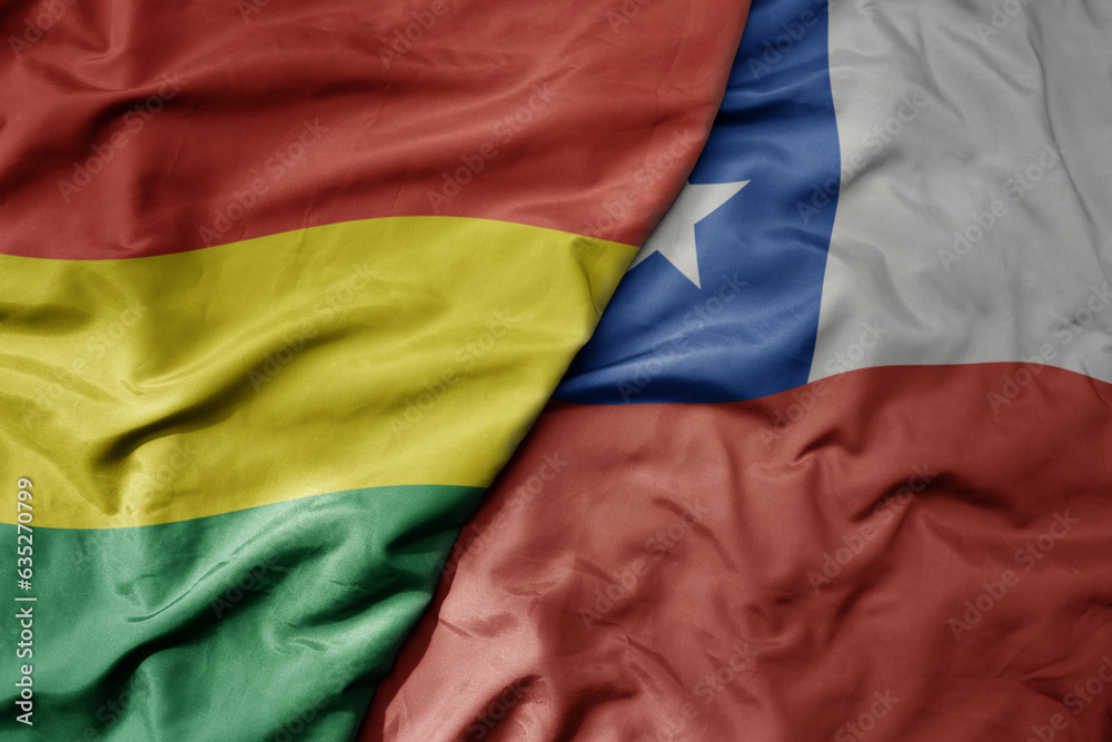 big waving realistic national colorful flag of bolivia and national flag of chile .