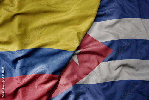 big waving realistic national colorful flag of colombia and national flag of cuba .