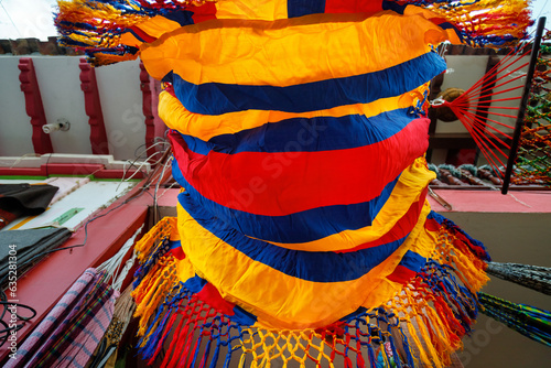 View from below of a hammock with the Colombian flag hanging in a shop in Raquira, Colombia photo