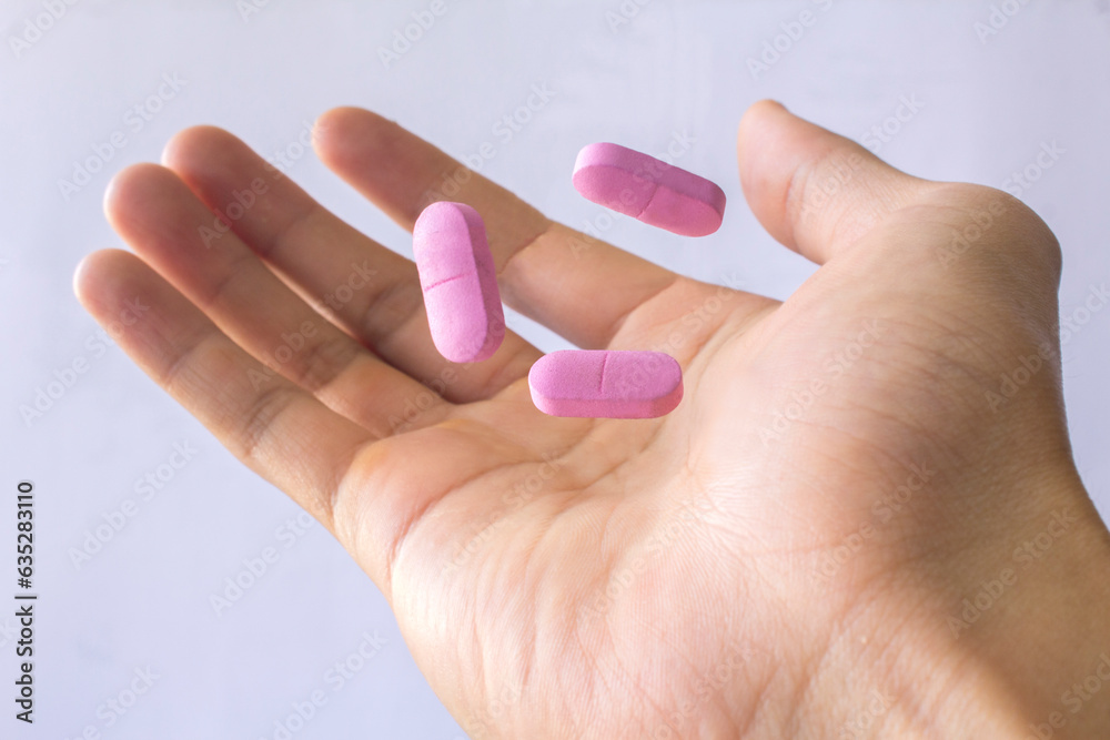 pill in hand with white background isolated