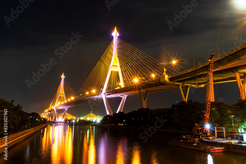 Bhumibol Bridge achitecture with night light at the chaophraya river landscape  photo