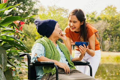 Konstfotografi Daughter taking care health elderly mother who is sick with cancer sitting in wh