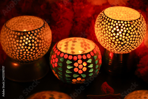 Diwali celebration Indian festival of lights Diya oil lamp lantern. Colors Rangoli decoration colorful flowers flowerbed copy space. Greetings Deepavali Hindu festival North India Mumbai Delhi India. photo