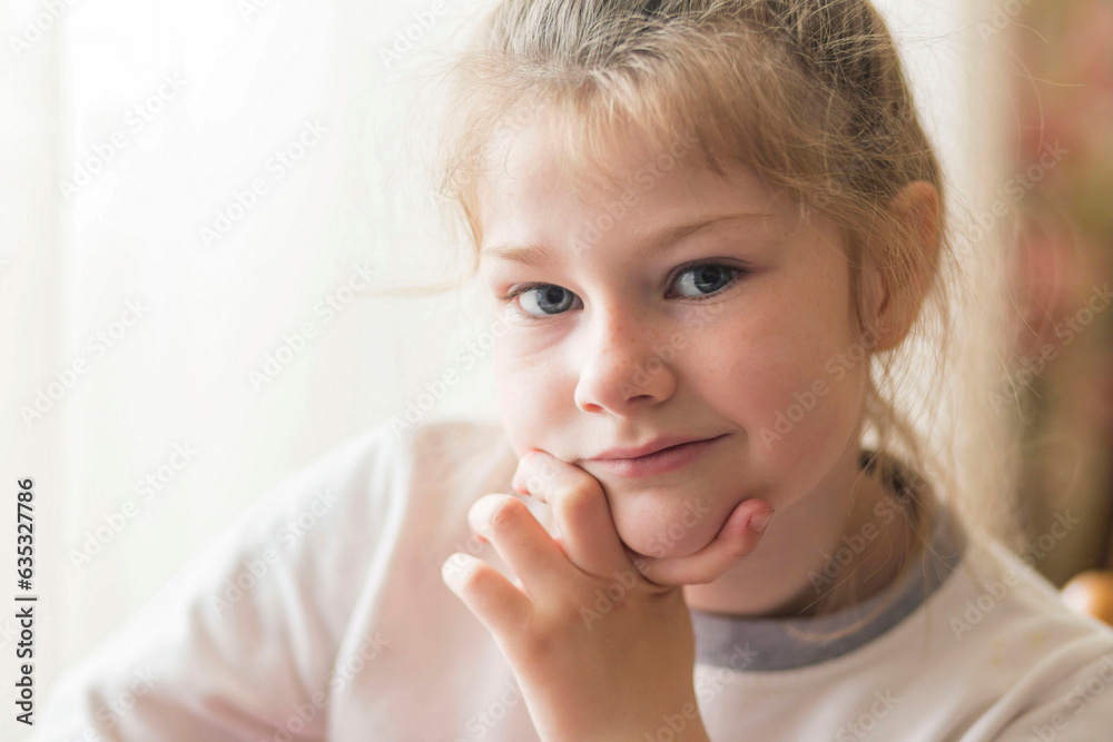 portrait of a beautiful emotional blonde girl in her room portrait of a beautiful emotional blonde girl in her room