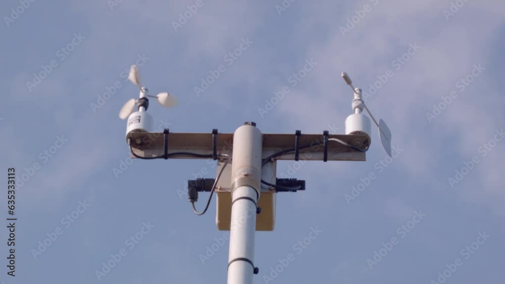 A low angle close up of the equipment used to measure wind speed and direction. A low angle close up of the equipment used to measure wind speed and direction.