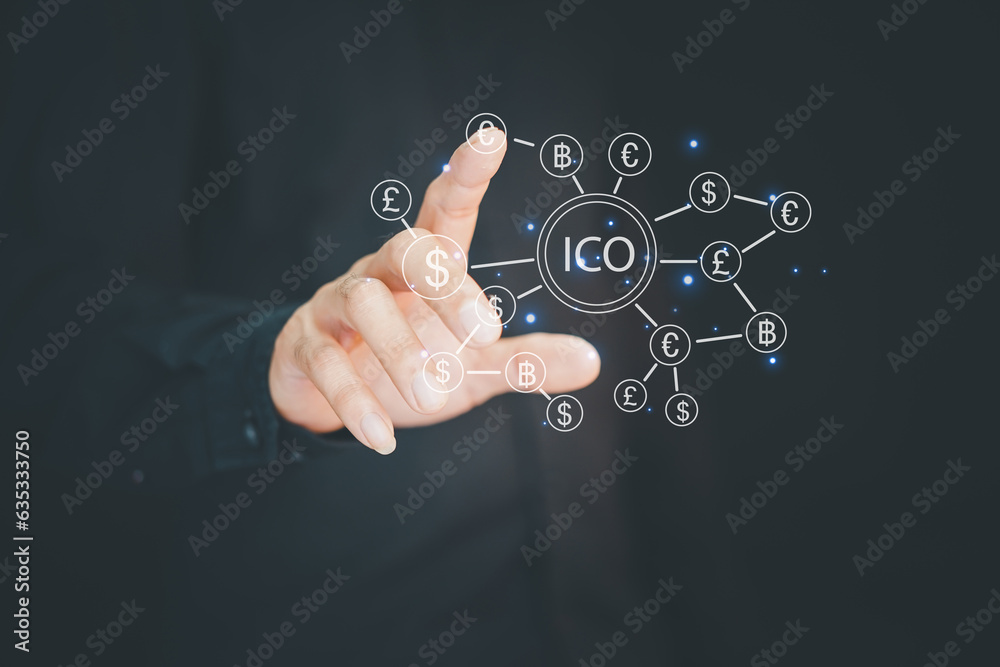 ICO ,Businessman presses button ICO Initial Coin Offering in network shield security virus user interface. ICO ,Businessman presses button ICO Initial Coin Offering in network shield security virus user interface.